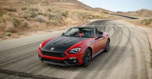 A red 2018 FIAT 124 Spider with a black carbon fiber hood, in Wichita, KS
