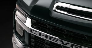 A close-up view of the headlight on a 2019 Chevrolet Silverado 2500 HD pickup truck