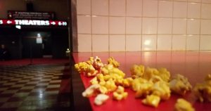 Some spilled popcorn on the counter top at a movie theater in Wichita, KS