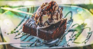A fudge brownie served with vanilla ice cream and chocolate syrup available at a local dessert shop in Wichita, KS
